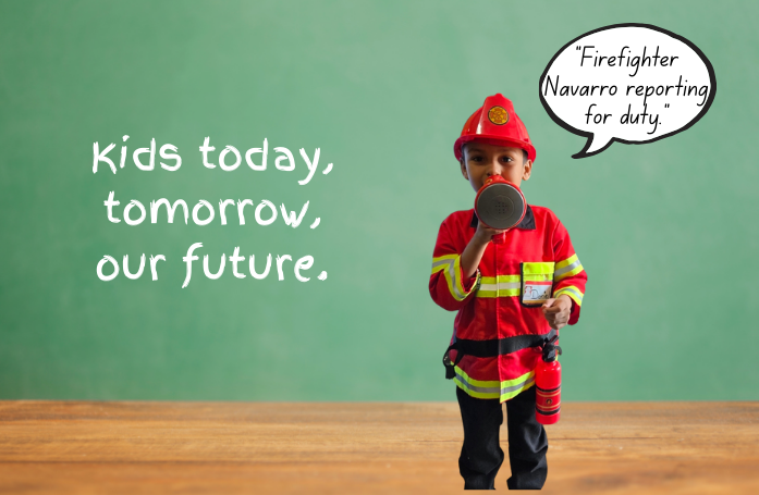  kid dressed as firefighter holding a mini bull horn to mouth